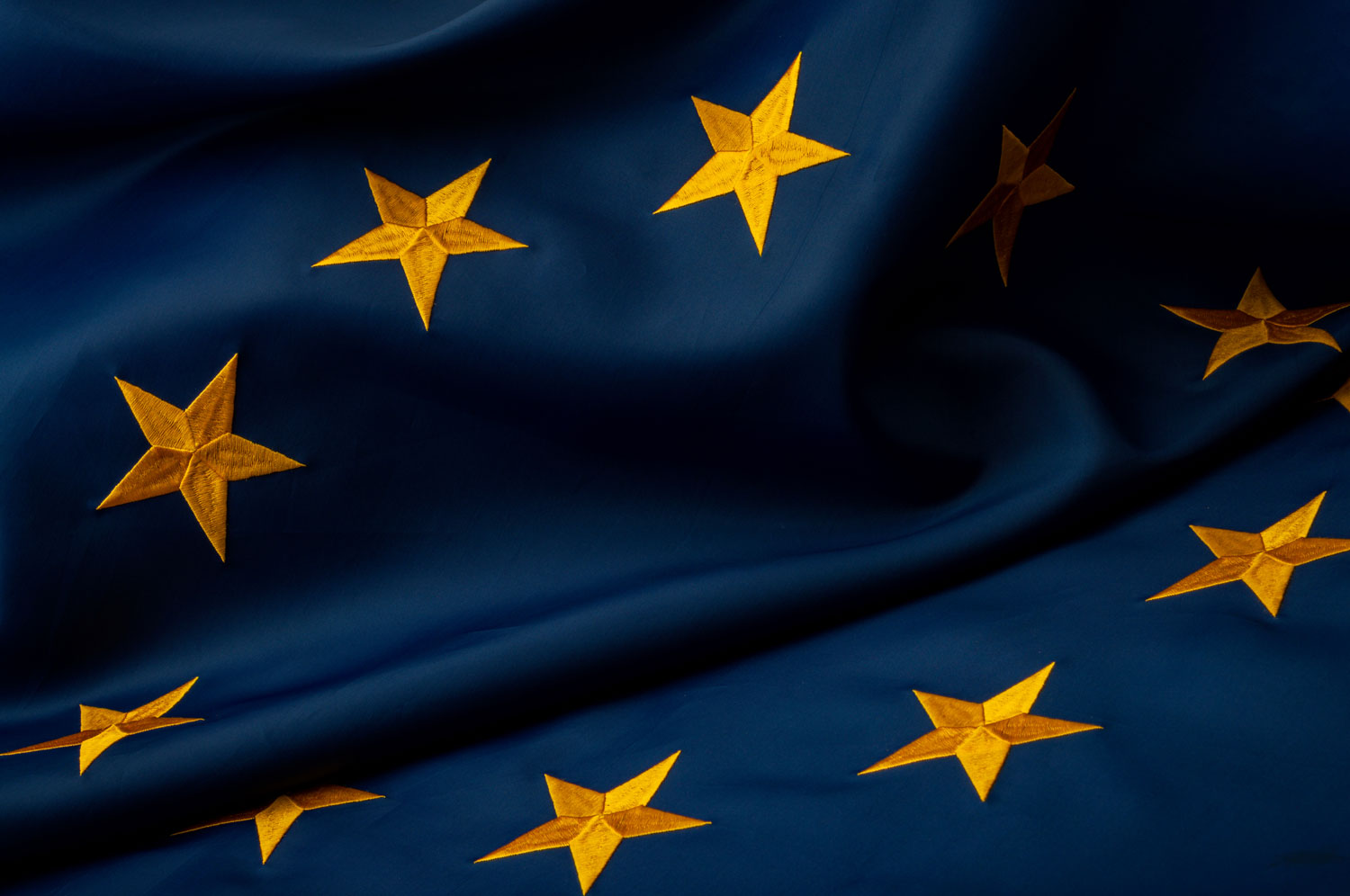 InternationalcollaborationpoliticalunityandeconomicpartnershipconceptEuropeanUnionflagwithyellowstarsonbluebackgroundwith InternationalcollaborationpoliticalunityandeconomicpartnershipconceptEuropeanUnionflagwithyellowstarsonbluebackgroundwith
